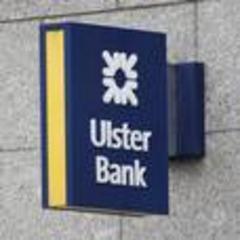 ulster bank cuts losses by nearly 50%